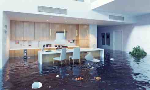 A kitchen setting flooded with water